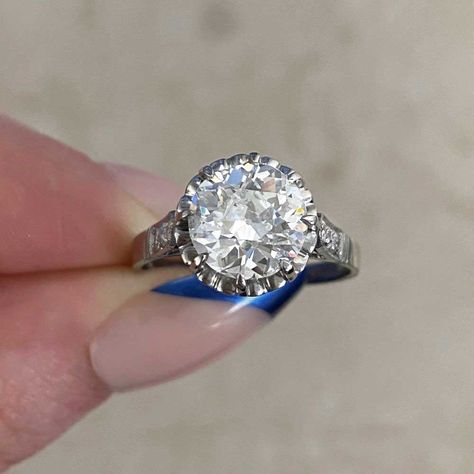 This elegant antique ring features an old European cut diamond center that is set in prongs and GIA-certified as 2.32 carats, J color, and SI2 clarity. Flanking each shoulder are three additional old European cut diamonds. This ring is further enhanced with a heart-style openwork design in the under-gallery, with two rows of additional old European cut diamonds set underneath and fine milgrain. The total approximate weight of the additional diamonds is 0.28 carats. From the Art Deco era, circa 1 Luxury Antique Diamond Ring With Single Diamond, Luxury Heirloom White Ring, Vintage Diamond Earrings, Estate Diamond Jewelry, European Cut Diamond Ring, Estate Jewelry Rings, Designer Diamond Jewellery, Colored Diamond Rings, Fancy Diamonds