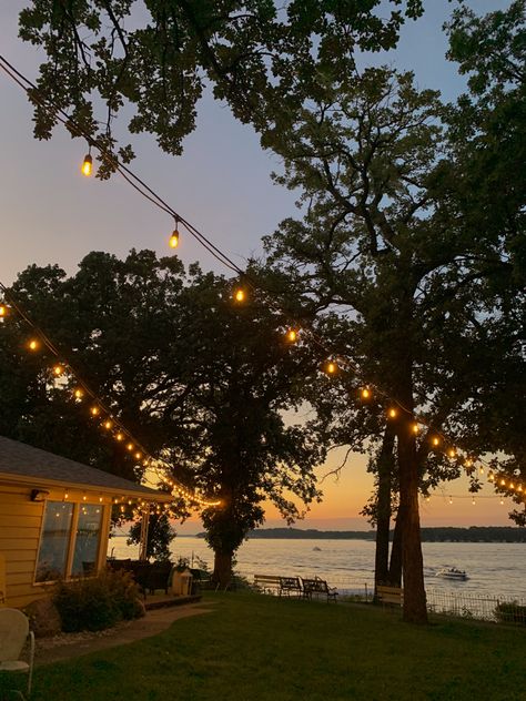 Beautiful lake sunset with string lights Porch View Aesthetic, Old Lakehouse Aesthetic, House On The Lake Aesthetic, Home By The Lake, Lake Resort Aesthetic, Lake Aethestic, California Lake House, Lake House Life Aesthetic, House On A Lake Aesthetic