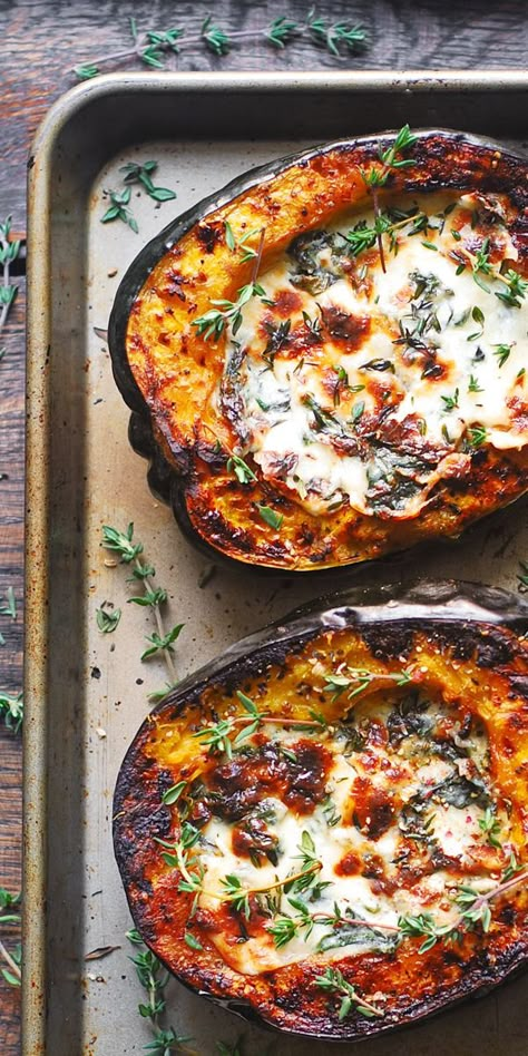 Stuffed Acorn Squash with Creamy Spinach and Cheese on a baking sheet Vegetable Stuffed Acorn Squash, Italian Acorn Squash Recipes, Fall Foods Vegetarian, Fall Meal Vegetarian, Baked Stuffed Squash, Acorn Squash Dishes, Fall Stuffing Recipes, Fall Dishes Healthy, Fall Vegetarian Side Dishes