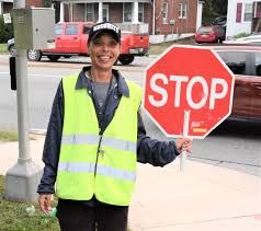 Crossing guard is a ray of sunshine for motorists Crossing Guard Costume, Guard Costume, Crossing Guard, Tractor Trailer Truck, School Zone, A Ray Of Sunshine, Yellow Vest, Smile And Wave, School Bus Driver