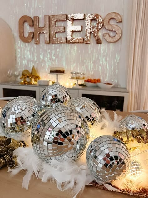 Ready to ring in the New Year in style? 🎉 Check out these 29 New Year’s Eve Party Ideas to Kick Off the New Year Right! From glamorous DIY decorations to sparkling drink stations and fun photo booth props, these ideas will make your party unforgettable. Try hosting a midnight countdown bar, serving delicious finger foods, or setting up a champagne tower for a show-stopping toast. Don’t forget party games like a resolution jar or balloon drop to keep the fun going. Disco Ball New Years Eve Decor, Nye Slumber Party, New Years Eve Party Home, New Year's Eve Party Decorations, New Years Eve Pj Party Ideas, Chic New Years Eve Party, Winter Wonderland New Years Eve Party, New Years Cocktail Party, Small Disco Ball Decor