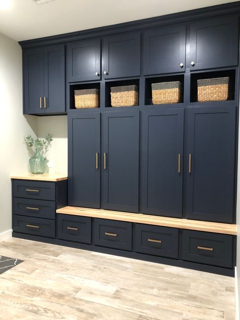 Custom built-in lockers in for drop zone area. C&E Builders used Benjamin Moore Hale Navy for the color and finished the hardware off with Berenson modern bronze swagger. Mudroom With Dark Cabinets, Mudroom With Counter Space, Cabinet Drop Zone, Large Mudroom Cabinets, Storage Cabinet With Counter, Mudroom Lockers With Drawers, Navy Mudroom Cabinets, Mudroom Locker Cabinets, Navy Blue Mudroom Cabinets