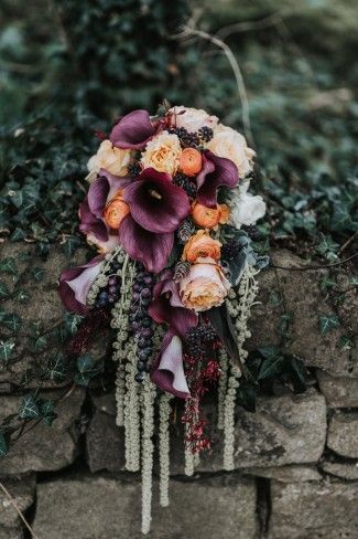 Lovely cascading bouquet for a Medieval Castle Wedding in Northern Ireland Deep Purple Wedding, Orange Purple Wedding, Orange Wedding Bouquet, Dragon Wedding, Cascading Bouquet, Burnt Orange Weddings, Medieval Wedding, Belle Isle, Cascade Bouquet