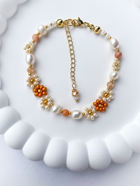 The Autumn beaded bracelet is dainty and elegant. The perfect gift for any woman, friend, sister, daughter, etc. 100% handmade using the best materials.  FEATURES:  * Seed beads sizes 2 to 4mm, freshwater pearls 5-7mm, natural stones 4mm, crystals 4mm. * 18k Gold Plated Lobster clasp and findings. * Made with love and care. LENGHT: Choose between 6.5 or 7 inches + Each bracelet comes with a 1 inch extender chain CARE INSTRUCTIONS: *Remove before exercising taking a shower/bath and sleeping. *Avo Autumn Accessories Jewelry, Fall Bead Bracelet Ideas, Autumn Seed Bead Bracelet, Autumn Beaded Bracelet, Autumn Beaded Jewelry, Fall Beaded Jewelry, Fall Beaded Bracelets, Christmas Beaded Jewelry, Fall Jewelry Inspiration