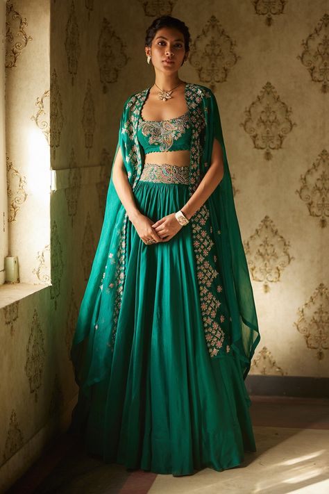 Shop for Mrunalini Rao Green Floral Embroidered Cape Lehenga Set for Women Online at Aza Fashions Bottle Green Indian Outfit, Bottle Green Outfit Women, Rama Green Lehenga, Celebrity Dresses Indian, Buttis Embroidery, Bottle Green Lehenga, Cape Organza, Mehandi Dress, Mehendi Dress