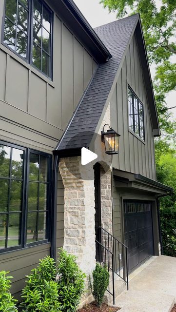 AMBER | New Build Designer on Instagram: "If you are looking for a dark and moody exterior paint color…look no further! 👀This was my first time using this color and definitely won’t be my last! 🖤  “Limestone” SW 9599 by @sherwinwilliams   #paintcolor #homebuilding #homedesign #homeexterior #homedecor #interiordesign #exteriordesign #sherwinwilliams #newconstruction" Tan House With Dark Brown Trim, Moss Green Exterior House Paint, Deep Creek Benjamin Moore Exterior, Modern Paint Colors Exterior Home, Bronze Windows Exterior Paint Colors, Grey Brick House Exterior Color Palettes, Ashwood Moss Benjamin Moore Exterior, Collingwood Benjamin Moore Exterior, Sw Eclipse Paint Exterior