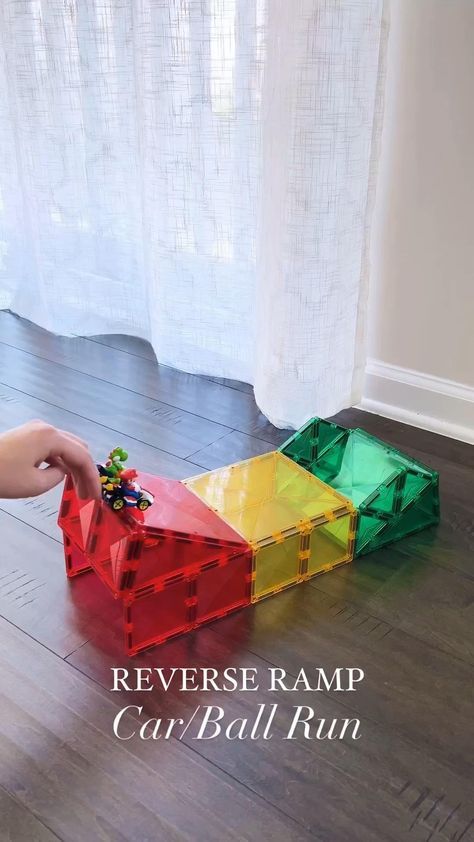 Switch things up with this reverse ramp design! @pandamommyteacher showcases that you don’t need a large Connetix Tile collection to have epic STEAM fun! To make this reverse ramp you need: ⭐ 3 big squares ⭐ 12 small squares ⭐ 4 isosceles triangles ⭐ 6 equilateral triangles Some top tips from Alice-  1. Build the back side first and close the back for support during building. Once you are done building, remove the two bottom pieces on the back to allow the cars/balls to come out. 2. Use light Magnetic Building Toys, Magnet Tiles, Magnet Activities, Magnetic Building Tiles, Ramp Design, Magna Tiles, Kids Activities At Home, Tiles Ideas, Magnetic Tiles