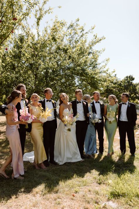 Spring Wedding Tuxes, No Bridal Party Wedding Photos, Bridal Party Colours Color Schemes, Th&th Bridesmaid Dresses, Pink And Yellow Groomsmen, Colorful Bridesmaids And Groomsmen, Wedding Colors Bridesmaids And Groomsmen, Spring Wedding Bridal Party Attire, Groomsmen With Mismatched Bridesmaids