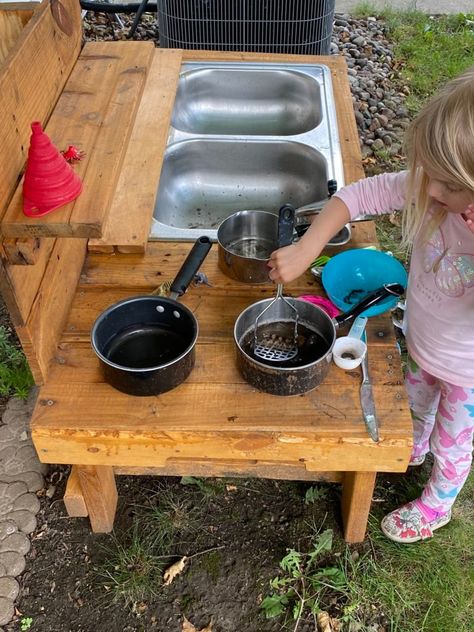 Make Your Own Mud Kitchen – Kids and Life Mud Kitchen With Water Dispenser, Kitchen With Water Dispenser, Pallet Mud Kitchen Diy, Outdoor Sinks Diy, Diy Mud Kitchen Outdoor Play, Mud Kitchen For Kids Diy, Mud Kitchen Plans, Mud Kitchen Diy, Kitchen Blueprints