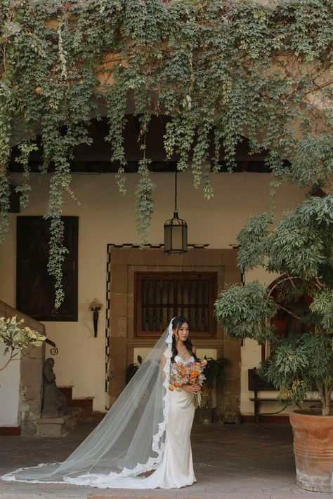 Add a touch of romance and Spanish glamour to your bridal attire with this luxurious mantilla cathedral veil. Combining a royal extra-long train with eyelash French lace edging, this veil will enchant both you and your guests with its billowing tulle and romantic lace. * Cathedral length veil or in a custom length  * Hand sewn from the most luxurious bridal illusion tulle * Mantilla style * 108'' width * In white, off-white, light ivory, ivory, or blush  * Add on silver and clear Czech beading or rhinestones to the lace for an extra charge (select "beaded lace trim" finish option upon check-out)  * The veil is attached to either a clear plastic hair comb or a metal hair comb (silver metal, gold metal, rose gold metal, or black metal) measuring 3'' in length for easy and secure placement in Bridal Veil Cathedral, Cathedral Length Mantilla Veil, Tiara With Veil, Tulle Veil, Long Veils, Mexican Wedding Vail, Long Wedding Veils Over Face, Lace Veil Cathedral, Traditional Mexican Wedding Veil