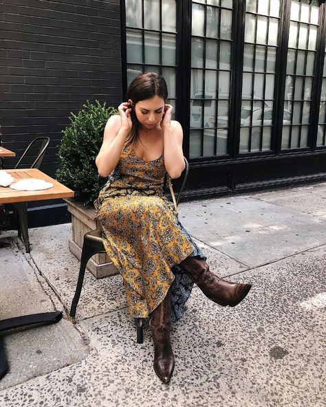 We’re all about an unexpected pairing, and the combination of a delicate, slinky slip dress with rugged boots is one of our current favorite contradictions. Dresses To Wear With Cowboy Boots, Thanksgiving Outfit Women Casual, Dress And Cowboy Boots Outfit, Wedding Cowboy Boots, Cowboy Boot Outfits, Dresses With Cowboy Boots, Fall Boots Outfit, Thanksgiving Outfit Women, Thanksgiving Dress