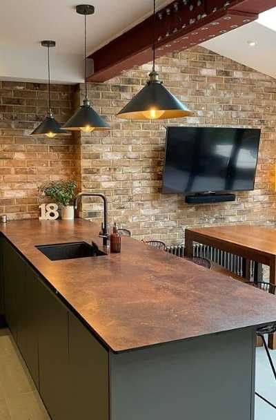 23 Kitchen & Bar Copper Countertop Design Ideas | Sebring Design Build Copper Kitchen Work Surface, Bronze Countertops Kitchen, Rust Kitchen Countertops, Copper Kitchen Benchtop, Copper Wrapped Kitchen Island, Bar Countertops Ideas, Charcoal And Copper Kitchen, Black And Copper Countertops, Copper Finishes Kitchen