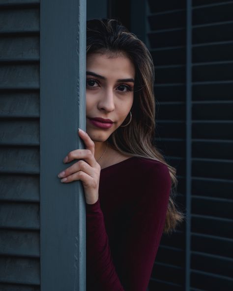 Mysterious looking girl wearing a red top hiding behind a blue wooden door Hiding Reference, Door Poses, School Paper, Sketchbook Inspo, Hidden Door, Poor Children, Follow On Instagram, Poses Reference, Pose References