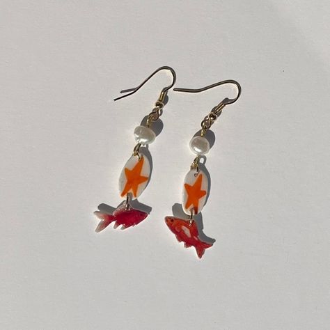 🎏 Go Fish! ——— Handcrafted by Rachel! ~SOLD! DM if want something similar~ #jewelry #handmadejewelry #earrings #charms #craft Wire Fish Diy, Clay Fish Earrings, Art Stall, Shrinky Dink Earrings, Clay Fish, Jewellery Dish, Fish Earrings, Earrings Charms, Jewelry Piercing