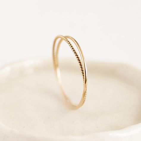 Two intertwined gold rings: a delicate braided band with a simple round-profile band. Double the fun! Him And Her Rings, Simple Promise Rings Gold, Braided Gold Wedding Band, Small Gold Rings Simple, Simple Promise Rings For Her Gold, Simple Everyday Jewelry, Small Gold Rings, Simple Gold Wedding Band Women, Simple Gold Rings Everyday