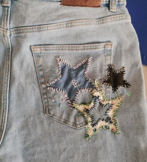 star embroidery and star patches on denim jeans diy Embroidery On Pants Diy, Jean Patching Ideas, Diy Denim Pants, Star On Jeans, Jean Hole Patch Ideas, How To Sew A Star On Jeans, Embroidery Symbols, Cute Diy Jeans, Embroidery On Jeans Pants