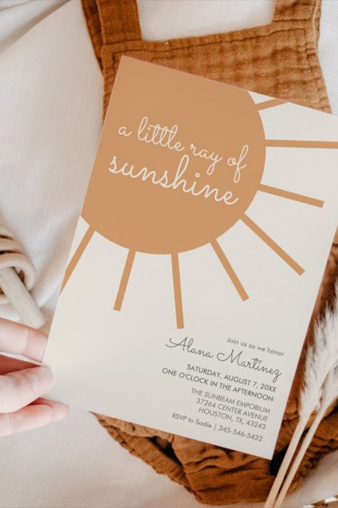 A delightful baby shower invitation adorned with sunshine motifs, ideal for welcoming a little one into the world. Our Ray Of Sunshine Baby Shower Theme, A Little Ray Of Sunshine Is On The Way, Little Ray Of Sunshine Baby Shower Ideas, Sunshine Baby Shower Ideas, Sunshine Baby Shower Theme, Orange Color Palette, Sunshine Baby Shower, Sunshine Design, Playful Typography