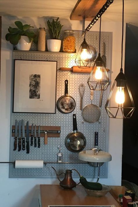 Tired of cluttered countertops? This clever vertical storage solution will transform your small kitchen and home! Check out our blog for more genius vertical storage ideas. Small Kitchen Vertical Storage, Pan Holder Hanging Wall, Peg Board Kitchen, Kitchen Pegboard Ideas, Vertical Storage Ideas, Kitchen Pegboard, Storage Solutions For Small Spaces, Pegboard Kitchen, Kitchen Wall Storage