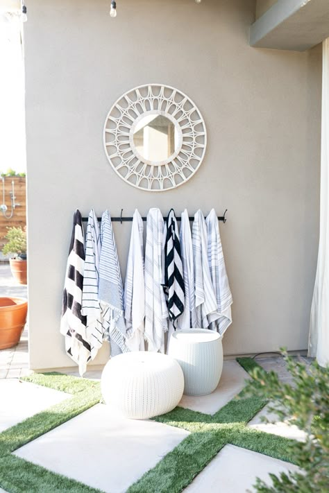 Towels By The Pool, Decorating Your Pool Area, Pool Area Organization, Poolside Wall Decor, Pool Deck Inspiration, Elegant Pool Decor, Pool Patio Ideas On A Budget, Beach Towel Rack Outdoor, Outdoor Poolside Decor