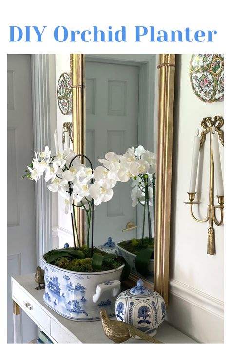 Orchid arrangement DIY blue and white planter Chinoiserie Planter Indoor, Faux Orchid Arrangements Home Decor, Orchid Living Room, Blue And White Footbath, Large Orchid Planter, How To Make Faux Orchid Arrangement, Orchid Entryway, Diy Chinoiserie Planter, Faux Orchid Arrangements Diy