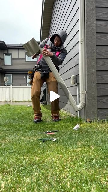 thesidingguy on Instagram: "I was hired to replace this missing kick-down extension.  There are many ways to do kick downs, but I had to match all of the other kick downs around the property, so this is how I did it.

These stay down all the time, and they lift up for when you mow the lawn.  Why aren’t these routed underground?  Our city has bylaws regarding which areas can be routed underground.  Many neighbourhoods have to have all surface drainage, so the extension brings the water away from the house to the swale line which typically runs on the property lines of houses. 

I hope this video was informative to you.  Thanks for watching.
.
.
.
.
.
.
.
.
.
.
.
.
.
#eavestrough #gutters #downspouts #aluminumeaves #aluminumdownspouts #raingutter #residentialconstruction #diy #repair" Gutters And Downspouts, Gutters On House, Home Drainage Solutions, Gutter Drainage Ideas, Underground Gutter Drainage, Building A House In A Flood Zone, How To Fix Drainage Problems In Yard, Diverting Water From Downspout, Foundation Drainage