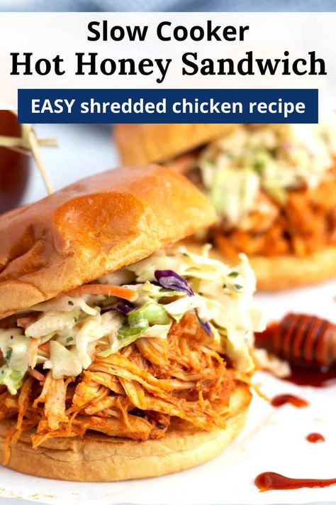 Make a crowd-pleasing, easy dinner with this Slow Cooker Hot Honey Chicken Sandwiches recipe! Cook your chicken breast low and slow in the Crock Pot for perfectly tender shredded chicken. Then cover in the best ever sweet and spicy sauce and layer on toasted buns with creamy coleslaw. The best part? The whole recipe only requires 15 minutes of hands-on time! Crock Pot Hot Honey Chicken Sandwich, Slow Cooker Nashville Hot Chicken, Shredded Chicken In Slow Cooker, Honey Garlic Chicken Sandwich, Chicken Sandwich Crockpot Recipes, Crockpot Hot Honey Chicken Sandwiches, Pulled Chicken Crockpot Recipes, Slow Cooker Hot Honey Chicken Sandwiches, Hot Chicken Sandwiches In Crockpot