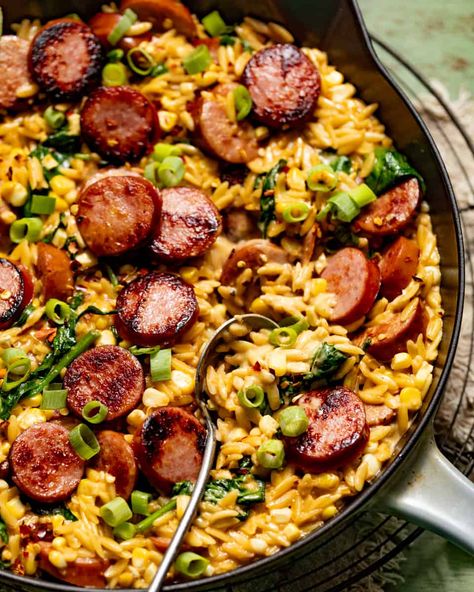 Creamy Cajun Orzo with Sausage (One Pan!) - Britney Breaks Bread Kielbasa Orzo Recipes, Jalepeno Sausage Meals, Orzo Jambalaya, Sausage And Orzo Recipe, Andullio Sausage Recipes, Sausage Orzo Recipes, Sausage One Pan, Cajun Orzo, Orzo With Sausage