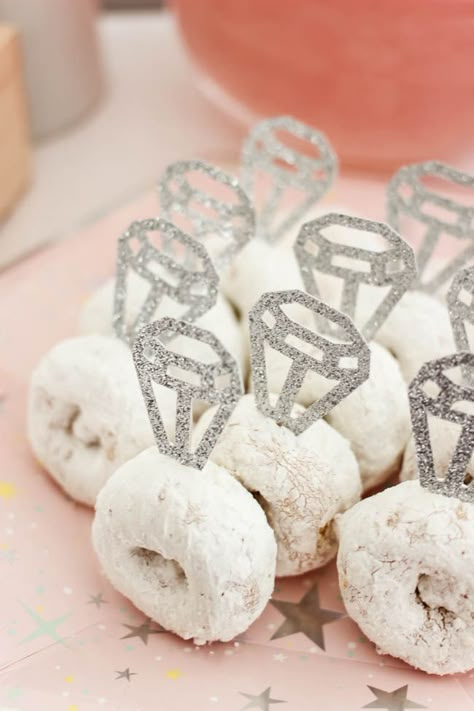 Cute donut rings! Beautiful Bridal Shower Decorations for the Modern Bride! Decorate with the Iridescent Martha Stewart Celebration Line, and personalize your party with the Cricut Explore 2! You're bride will be thrilled with the subtle glitter and glam in these pink and silver decorations! #cricutexplore #bridalshower #modernbride #woodaccents Simple Modern Bridal Shower Decor, Cricut Projects For Bridal Showers, Celebrating The Future Mr And Mrs, Bridal Shower Ideas Donut, Pink And Silver Bridal Shower Ideas, Bridesmaid Party Decoration, Wedding Stuff Made With Cricut, Bridal Showers After The Wedding, Cute Bridal Shower Decor