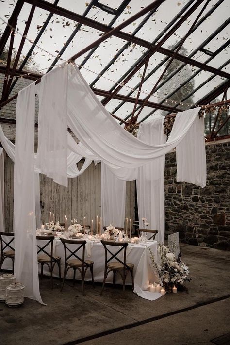 Ivory Polyester Tablecloth Wedding, Drape Wedding Reception, Candle Table Wedding Decor, Fabric Drapes Wedding, Roof Draping Ideas, Glass Roof Wedding, Glass Room Wedding, White Ceiling Drapes Wedding, Linen Drapes Wedding