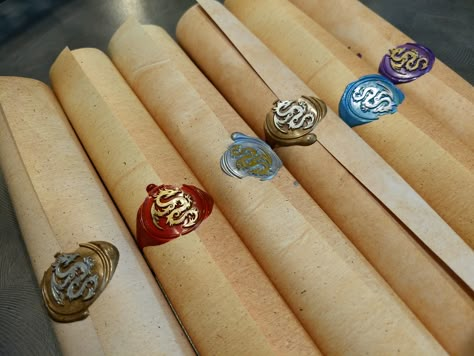 For our daughter's "Wings of Fire" dragon-themed party, we created these scrolls for the invitations. To make them, we purchased aged-looking paper, a dragon seal, colored beads of wax, and a set of gold and silver ink pens to decorate the seals. Mythical Party Ideas, Fantasy Themed Party Ideas, Fantasy Party Favors, Fantasy Birthday Party Ideas, Dragons Birthday Party Ideas, Got Theme Party, Mythical Party, Dragon Theme Party, Fantasy Birthday Party Theme