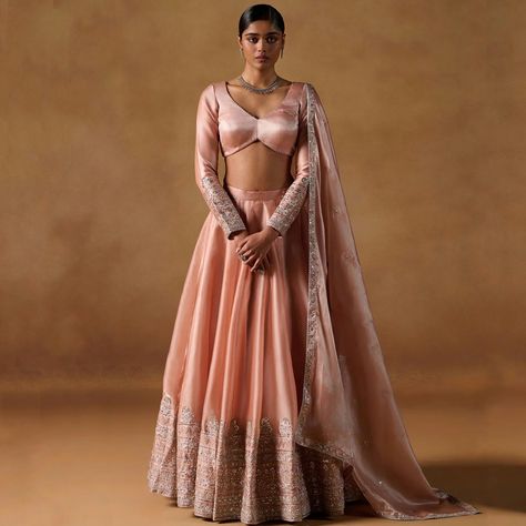 Bonica| Formals | Suno Saheli Description Our Dusty Coral Tissue Lehenga exudes dreamy sophistication. With a tissue organza top and satin inner, a flowing lehenga, and a matching dupatta, it’s designed to turn heads. Adorned with intricate work—sequins, thread, zari, and hand-crafted embellishments—it’s the perfect blend of tradition and style. Made in Pakistan and meticulously hand-checked for unmatched quality, because every detail matters. Color: Dusty Coral Fabric: Choli & Lehnga :- Sa... Tissue Lehenga Designs Latest, Tissue Organza Lehenga, Organza Lehanga Design, Indian Lehngas, Organza Dupatta Embroidery, Tissue Lehenga, Lehenga Designs Latest, Tissue Dupatta, Maroon Lehenga