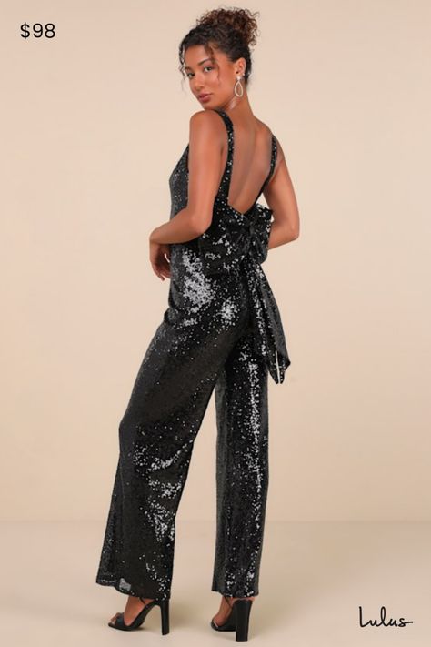 Walking in like you own the place is exactly how the Lulus Feeling Sparkly Black Sequin Bow Wide-Leg Jumpsuit is supposed to make you feel! This fabulous jumpsuit is sure to make you the shiniest sight in any room with its dazzling black sequin composition that shapes a princess-seamed bodice with a V-neckline and a flirty open back design, all supported by wide straps. The high fitted waist tops trendy wide pant legs that fall to ankle-grazing hems. The dramatic, oversized bow detail at the bac Bow Jumpsuit, Sparkly Jumpsuit, Disco Fashion, Tops Trendy, Sequin Jumpsuit, Country Concert Outfit, Sequin Bow, Disco Outfit, Wide Pants