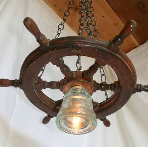 Using Ship Wheels for the Perfect Touch in your Beach House - Beach Bliss Living Nautical Exterior, Ship Wheel Decor, Nautical Chandelier, Pirate Bar, Nautical Bathroom Design Ideas, Boat Furniture, Beach Lighting, Nautical Lighting, Wheel Chandelier