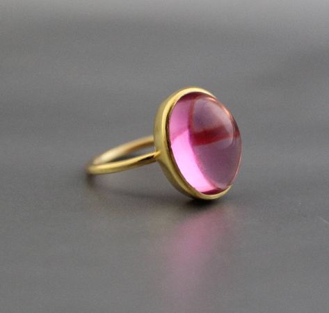 ♦♦ Beautiful handcrafted ring  ◘Stone Information:     Pink Quartz -     Color: Pink     Cut: Oval Cabochon ◘ Metal: 925 Sterling Silver ◘ Band: 2 mm  ◘ Setting: Open back bezel setting ◘ Finish: High polish  ◘ Nickel free  ◘ Handmade band: 14 gauge solid sterling wire    This ring is adorably rustic, easy to wear, & stackable! ◘Please Note - The Ring in the Picture can be available or  Sold out. Every  Ring is Made of a     Unique Gemstone. Therefore, Colors and Inclusions of the Stone may Vary Rose Quartz Gemstone Ring, Pink Ring With Polished Finish, Gold In Quartz Ring, Elegant Pink Cabochon Rings, Pink Quartz Ring, Pink Gemstone Ring, Rings Oval, Simple Rings, Quartz Color