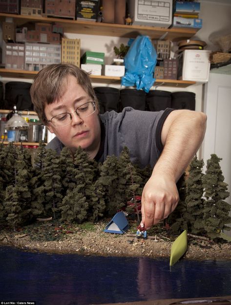 In a sense: Artist Lori Nix puts the finishing touches to a model in her studio. She says it takes her about seven months to complete a model Lori Nix, Peter Gabrielse, Photography Animation, The Poseidon Adventure, Model Sculpture, Model Diorama, Photographic Projects, Miniature Photography, City Ideas