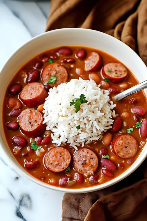 Get a taste of Louisiana with this red beans and rice recipe! Learn how to make it, plus, get tips for leveling up the dish and storing your leftovers. Chili Beans And Rice, Louisiana Dinner Recipes, Louisiana Beans And Rice, Rice And Beans Recipe Easy, Beans And Rice Crockpot, Red Beans And Rice Crockpot, Red Beans And Rice Soup, Rice And Bean Soup, Quick Red Beans And Rice