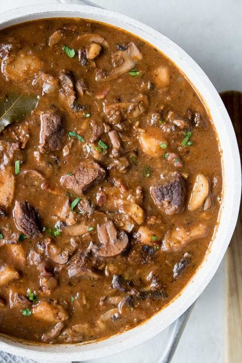 This hearty beef and mushroom stew recipe, complete with bacon, parsnips and red wine, is the perfect meal for a cold day. Beef Stew With Mushrooms, Beef And Mushroom Stew, Ground Beef Breakfast, Spaghetti With Ground Beef, Chicken Shawarma Recipe, Mushroom Stew, Shawarma Recipe, Chicken Tikka Masala Recipes, Ground Beef And Potatoes