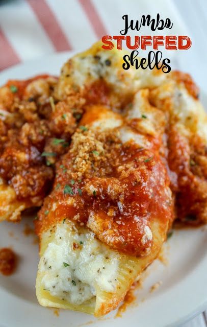 Olive Garden introduced new jumbo features and one was the Jumbo Stuffed Shells. They're stuffed with four cheeses and then topped with marinara and alfredo sauce. And they are delicious!!! But you don't have to go to Olive Garden to get them - you can have them in your own home! #olivegarden #copycatrecipes #stuffedshells Stuff Noodles Shells, Stuffed Shells With Cream Cheese Recipe, Giant Stuffed Shells Recipe, Meat Sauce Stuffed Shells, Jumbo Shells Recipe Beef, Beef Stuffed Shells Ricotta, Stuff Jumbo Shells, Stuffed Shells Pasta Recipes, Spaghetti Stuffed Shells