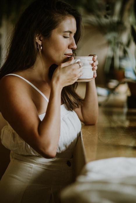 Health Vibes Aesthetic, Tea By The Sea, Tea Time Photoshoot, Person Drinking Tea, Drinking Tea Aesthetic, Japanese Wellness, Drinking Tea Photography, Winding Down Before Bed, Tea Photoshoot