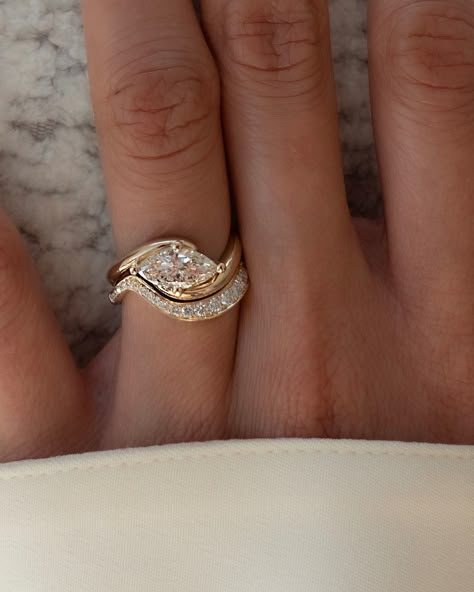 Wedding goals • Instagram East West Marquise Ring Gold, Bypass Wedding Ring Set, Wrapped Engagement Rings, Tania Sarin Engagement Ring, Vintage East West Ring, Classic Wedding Rings Gold, Wedding Rings Thick Band Unique, Abstract Diamond Ring, Half Bezel Set Engagement Ring