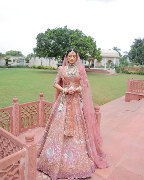 SetMyWed.com | Styling a daytime bridal ensemble with a whisper-soft pastel pink lehenga, eye-catching jewelry, and a subtle, radiant makeup look... | Instagram Reception Lehenga Bridal Pastel, Reception Lehenga Bridal, Bridal Reception Lehenga, Girly Suit, Pastel Bridal Lehenga, Wedding Couple Dress, Pastel Pink Lehenga, Bride Lehenga, Radiant Makeup