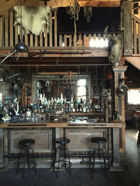 My families "Barn" that has a full western inspired bar, complete with an assortment of guns, antiques and taxidermy. Quentin Tarantino would love this property #thehatefuleight #antiques #saloon #canada #cabin #barn #countryliving #countryhome #loghome #taxidermy #loft #antiquebar #antiquedesign #westernstyle Diy Saloon Bar, Old Saloon Bar Ideas, Old West Saloon Bar, Cowboy Saloon Bar, Old Saloon Aesthetic, Old Saloon Bar, Cowboy Bar Aesthetic, Western Cantina, Western Bar Aesthetic