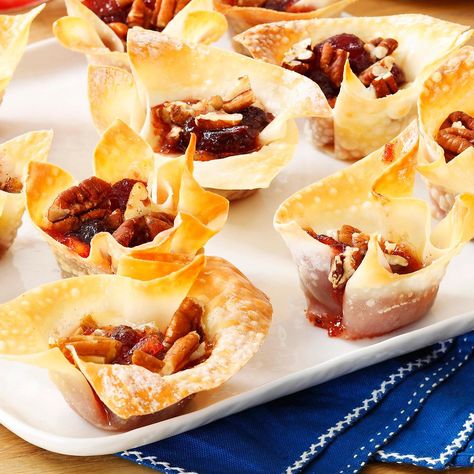 Cranberry-Pecan Brie Cups Recipe -These appetizer cups are great for entertaining since you can make them ahead of time and refrigerate until you're ready to pop them in the oven. Serve them hot out of the oven or at room temperature—your choice.—Trisha Kruse, Eagle, Idaho Wonton Ideas, Brie Cups, Wonton Wrapper Recipes Appetizers, Pecan Brie, Baked Wontons, Wonton Wraps, Wonton Wrapper Recipes, Appetizer Cups, Eagle Idaho