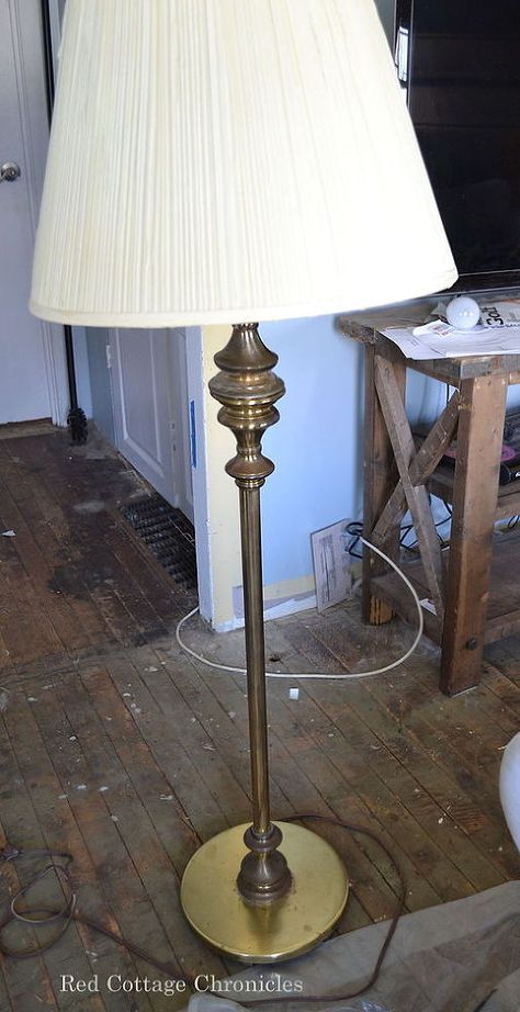 When I participated in the One Room Challenge, I was looking for a new floor lamp to tie into my casual coastal feel.  I didn't have to look too far! My Aunt was relocating from her home to a retirement apartment and she had this old brass lamp with a cream colored pleated shade.  The brass was showing its age and was dull and uninteresting. I had an old burlap shade I had actually put in the garbage pile!  I pulled it out, taped off some stripes and painted them in with some blue craft ... Floor Lamp Redo, Floor Lamp Makeover, Lamp Redo, Garden Diy Ideas, Furniture Redos, Lamp Makeover, Concrete Lamp, Pottery Barn Inspired, Floor Lamps Living Room