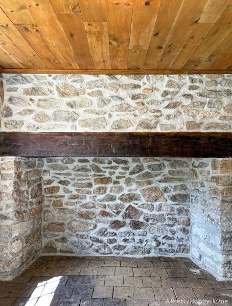 250-year-old stone fireplace makeover using lime mortar to repoint stones.   #stonefireplace #limemortar #oldbuildings #historicconstructiontechniques #historicconstruction #repointing #woodmantel Mortar Washed Stone Fireplace, White Mortar Stone Fireplace, Grouting Stone Fireplace, Heavy Mortar Stone Fireplace, Over Grouted Rock Fireplace, Mortar Wash Stone Fireplace, Update Stone Fireplace, Over Grout Exterior Stone, Lime Stone Wall