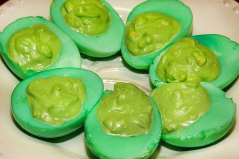 This simple but fun recipe Grinched Eggs is my green take on Deviled Eggs. My kids love em' and got a kick out of the green eggs and filling. Even better, they take only a few minutes to make and are a hit at parties! Green And Yellow Food Ideas, Grinch Deviled Eggs, Green Deviled Eggs, Dyed Deviled Eggs, Grinch Night, Devilled Eggs Recipe, Grinch Birthday, Colorful Recipes, The Grinch Who Stole Christmas