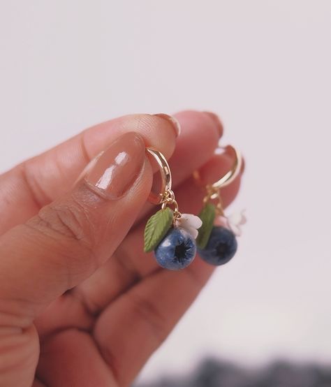 Miniature magic! ✨ These blueberry earrings are like tiny pieces of summer sky. Handcrafted with love and polymer clay, each one is unique. They’re the perfect pop of color for your everyday look or a fun night out. Trust me, you’ll be berry obsessed! 🫐💜 Fruit Earrings Polymer Clay, Blueberry Clay Earrings, Tiny Clay Earrings, Blueberry Earrings, Berry Earrings, Fimo Jewelry, Clay Making, Clay Things, How To Make Clay