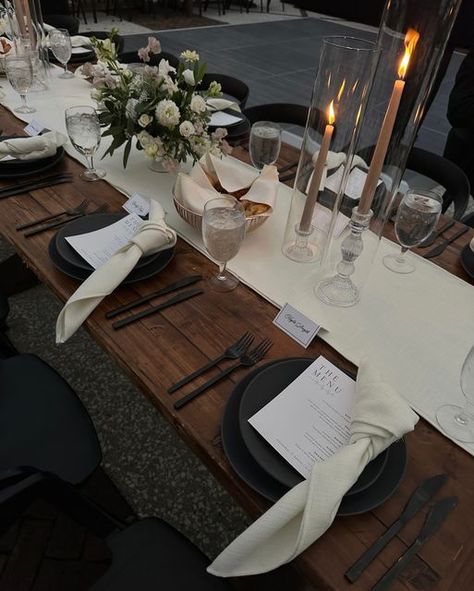 Mumu Weddings shared a post on Instagram: "the tablescapes were definitely some of my favorite details from the wedding—the black table settings and dark wood contrasted with the lush greenery of south carolina was so elegant and timeless. it truly was a stunning black tie affair!". Follow their account to see 4549 posts. Black Place Mat Table Setting, Dark Wood Table Setting Ideas, Black And Wood Dinner Table, Table Runner On Dark Wood Table, Black And Wood Table Setting, Masculine Dinner Table Decor, Wood And Silver Decor, Black Cheese Cloth Table Runner Wedding, Black Table Runner Decor