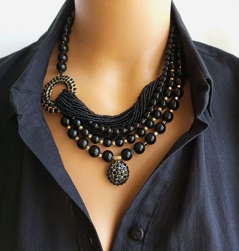 Elevate your outfit with this stunning Chunky Onyx Statement Necklace. This unique multi-strand natural stone jewelry piece is handmade with care and attention to detail, making it a standout addition to your collection. The combination of chunky onyx beads and intricate beading creates a bold and elegant look that is sure to turn heads. Give the gift of timeless beauty with this ideal gift selection f...#Jewelry #The #Statement #of #a #JewelryLovers #Making #Allure #Fashion #Gemstone #Chunky Large Bead Necklace, Handmade Beaded Necklace, Multi Strand Beaded Necklace, Handmade Beaded Necklaces, Onyx Jewelry, Chunky Jewelry, Natural Stone Jewelry, Necklace Unique, Unique Birthday Gifts