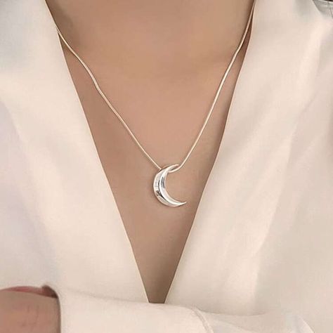 New in: Our Crescent Moon Silver Pendant ✨🌙 Inspired by the beauty of the night sky, this crescent moon pendant is crafted to add a touch of elegance to your everyday style. Whether you’re dressing up for an evening out or adding a subtle glow to your daily look, this piece brings celestial charm to any outfit. 🌙 💎 Shop now and embrace the magic in the details! . Moon pendant | jewellery | stainless steel | necklace | Crescent Moon Pendant, Outfit Shop, The Night Sky, Steel Necklace, Moon Pendant, Trendy Jewelry, Stainless Steel Necklace, Daily Look, Crescent Moon